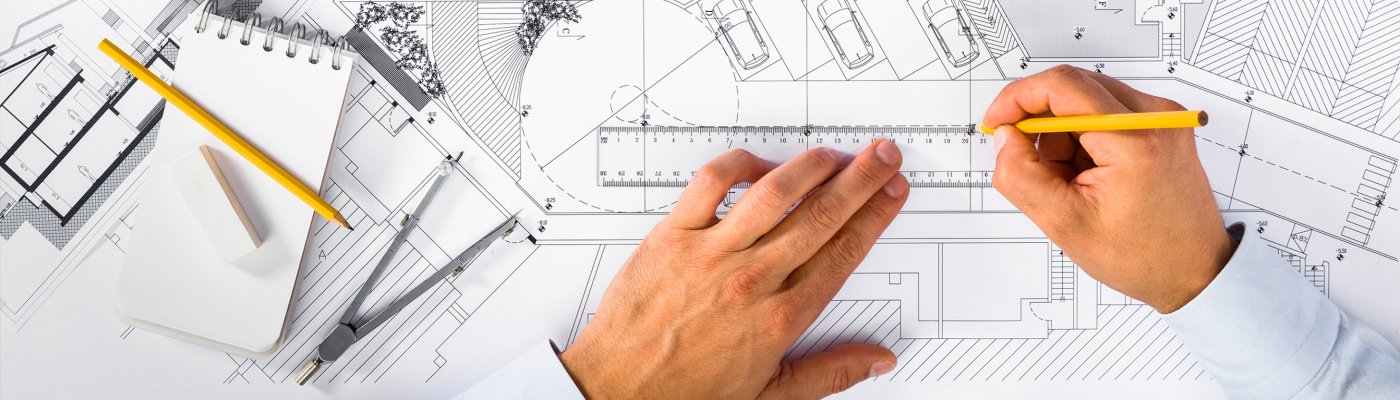 Top,View,Of,Construction,Plans,And,Male,Hands,Drawing,On